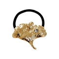 Goldenes Ginkgo-Haargummi mit funkelndem Strassstein auf schwarzem Elastikband - Ginkgoblatt mit Strass