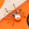 Spilla a ragno vintage in metallo bronzato con una grande perla sintetica - Bianco Argento Antico