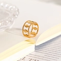 Detailed view of an 18k gold plated stainless steel open ring on a book page - 3-Layer Diamond Geometric Open Ring