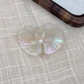 Macro detail of orchid hair clip in pearlescent acetate with central pearl inlay - Mermaid Color