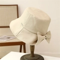 Beige woven bucket hat with large bow and gold metal logo charm for women's sun protection - M (56-58cm) / Off-white