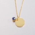 Close-up of a gold round disk pendant necklace with a blue sapphire birthstone charm - 3# Birthstone