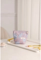 Detail of pink and blue jacquard floral makeup bag on a decorative white tray with golden brush - Pink Blue Floral