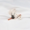 Elegant crane brooch with colorful enamel and pearl drop pendant on white silk fabric - Flying Crane Up
