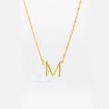 Detail view of a gold S925 silver necklace featuring a letter M pendant with a small diamond - M
