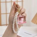 Pink Capybara liquid quicksand keychain featuring faux pearl strap and golden ring - Chain Style-Sugar Lying Back