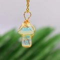 Handmade wire-wrapped opal mushroom pendant necklace with a golden chain finish - Opalite Gold-tone