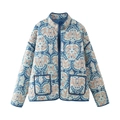 Detail of blue quilted cotton jacket featuring vintage paisley print and front patch pockets - XS / Light Blue Floral