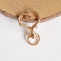 Close-up of heart-shaped gold alloy swivel clasp for keychain and bag accessory - KC Gold