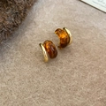 Detail of vintage tiger eye geometric bead pendant earrings on beige textured fabric - Alloy Amber Jewelry (110#) / Gold Amber