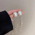 Elegant silver tassel earrings featuring white stones and cascading rhinestones - Silver Opal Rhinestone Tiered Tassel (E0207)