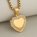 Gold heart locket necklace with sparkling crystal borders on beige background - Pendant Only / Gold
