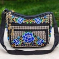 Ethnic style black crossbody bag with blue floral embroidery and layered zipper design - Blue Lotus