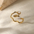 Detail of leaf-shaped ring with natural stones and pearl on beige textured background - Gold Leaf Pearl Green Gem Style (G11207261G-1) / Gold