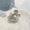 Detail of floral acetate hair claw with marble texture, pearl center, and iridescent shine - 5.3cm / Gray Mermaid