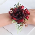Elegant wrist corsage featuring a burgundy silk rose with gold berries and ribbon - Wine Red - Wrist Corsage