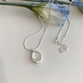 Minimalist silver necklace with irregular circular pendant on a clean white background - Irregular Ring Minimalist Necklace