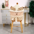 Detail of Christmas reindeer chair cover with golden antlers and snowflake scarf on chair - Gold Fawn