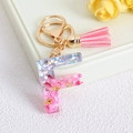 Letter F resin keychain with pink glitter flakes and matching soft tassel pendant - Letter F / Pink