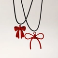 Red bow pendant necklaces with solid and hollow designs on black cords, stylish accessories - Large and Small Bow Necklace Set