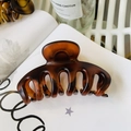 Detailed close-up of large tortoiseshell hair claw clip with glossy finish and metal spring - Keel Style Claw / Approx 11cm / Matte Red Brown