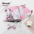 Manual cherry pink folding umbrella with newspaper print and matching bow accessory - Special Manual Style / Pink