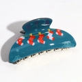 Detailed view of teal semicircular hair claw with festive red and white Christmas socks - Blue Large Semicircle