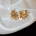 Elegant gold layered flower earrings on white silk background with metallic finish - Flower Shape / Gold
