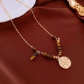Gold Libra zodiac necklace with tiger eye beads and round pendant on silk background - Gold Brown Balance Scale Tiger Eye Necklace (#51)