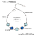 Silver-toned stainless steel bracelet featuring faceted blue glass stones and adjustable chain - Bracelet Only / Steel Blue Mix