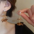 Close-up of vintage resin flower earrings with gold stem and sparkling diamond detail - 45# Silver Earring Post Gold Coffee Flower
