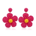 Detailed view of pink woven flower earring with yellow center and raffia texture - Raffia Flower Shaped Style(#21)