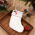 White knitted Christmas stocking with red letter S embroidery and holly leaf pattern - Letter S