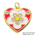 Macro detail of heart flower pendant with red enamel, green zircon and gold plating - Red White Enamel Flower Style