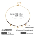 Collana di perle in acciaio inossidabile con ciondoli a stella d'oro su sfondo bianco - Oro/Perline Grigio Nero