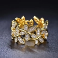 Elegant gold leaf ring with sparkling crystals featuring an adjustable branch design - US 7 / Gold Color
