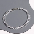 Elegant silver-tone tennis bracelet with pear-cut cubic zirconia stones on gray board - Pear Cut (Silver 4)