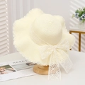 Elegant beige straw sun hat with wavy brim and large white lace floral bow decoration - Lace Plum Wave Creamy White