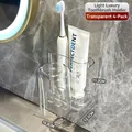 Transparent wall-mounted toothbrush holder set with four slots and inverted cup design - 4 Pieces Set - Transparent