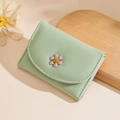 Mint green trifold wallet for women featuring a 3D daisy flower and textured leather - Light Green