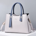Elegante borsa a mano in pelle PU bicolore bianco e blu con dettagli dorati e tracolla - Grigio