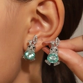 Hollow rabbit stud earrings in silver finish with sparkling light blue crystals - Stud Earrings (K-660) / Light Blue Gemstone