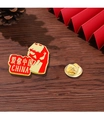 National Day star badge with red enamel and golden finish on a wooden surface - Love China