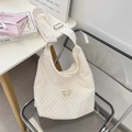 Cream canvas tote bag with pink star print and adjustable strap in cozy room setting - Pink Star