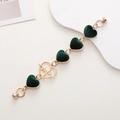 Detail of gold metal phone chain with dark green velvet hearts and ECG connector - Heart Beat / Dark Green