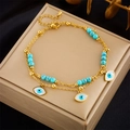 Double-layered gold chain anklet featuring turquoise beads and blue evil eye pendants - Evil Eye