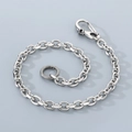 Close-up of silver punk trousers chain featuring a skull clasp and textured ring detail - Small Skull Buckle / 40CM