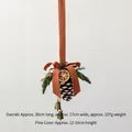 Christmas pine cone ornament with bells, orange slices and dried pine needles - Frosted White Pinecone B