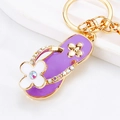 Purple flip-flop keychain with white flower and rhinestone accents on gold metal - Purple Clover Flip-flop