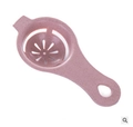 Pink plastic egg separator with yolk holder and protein filter holes on white background - Wheat Pink